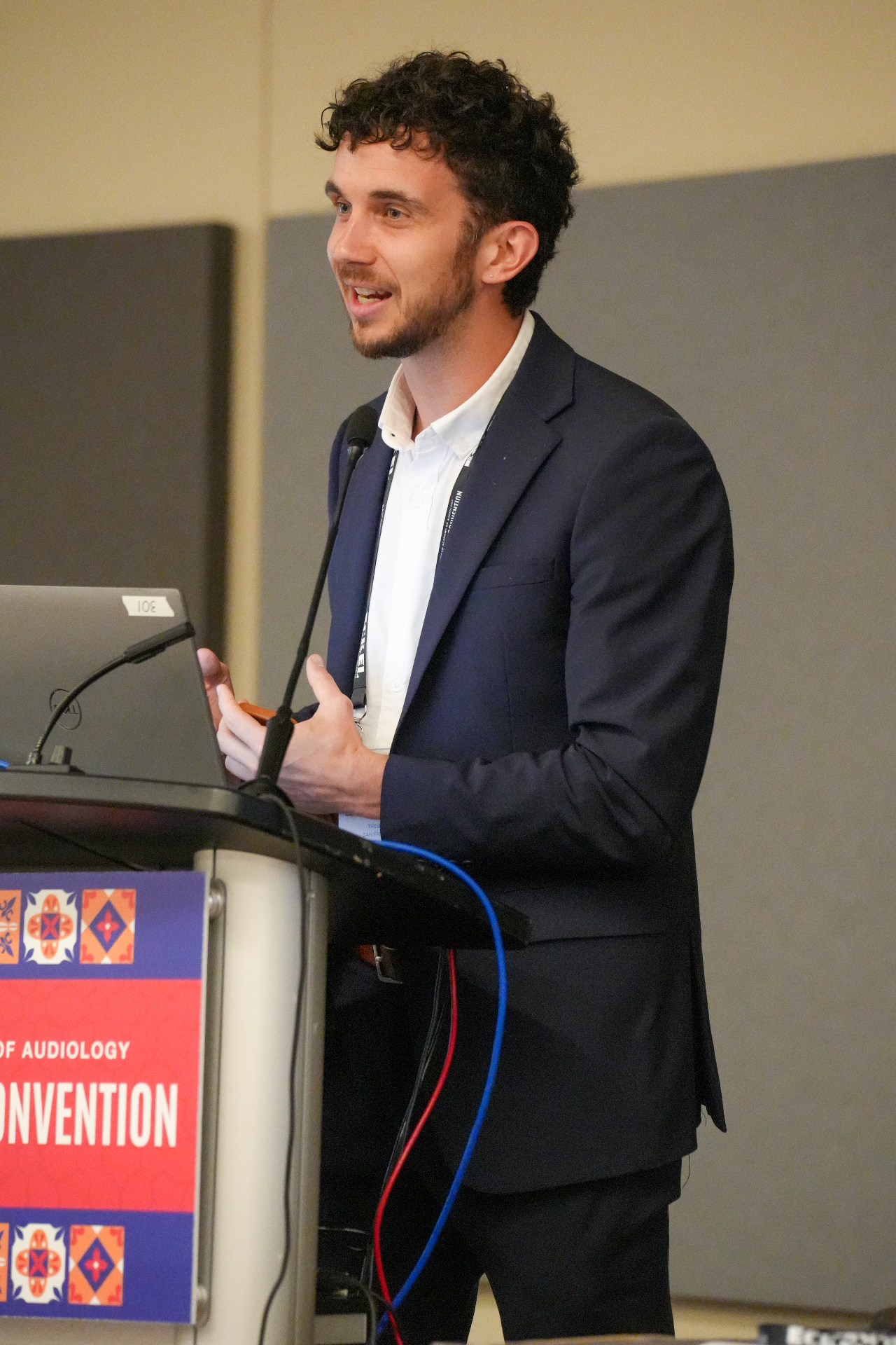 Ben presenting to a room of audiologists at a professional conference